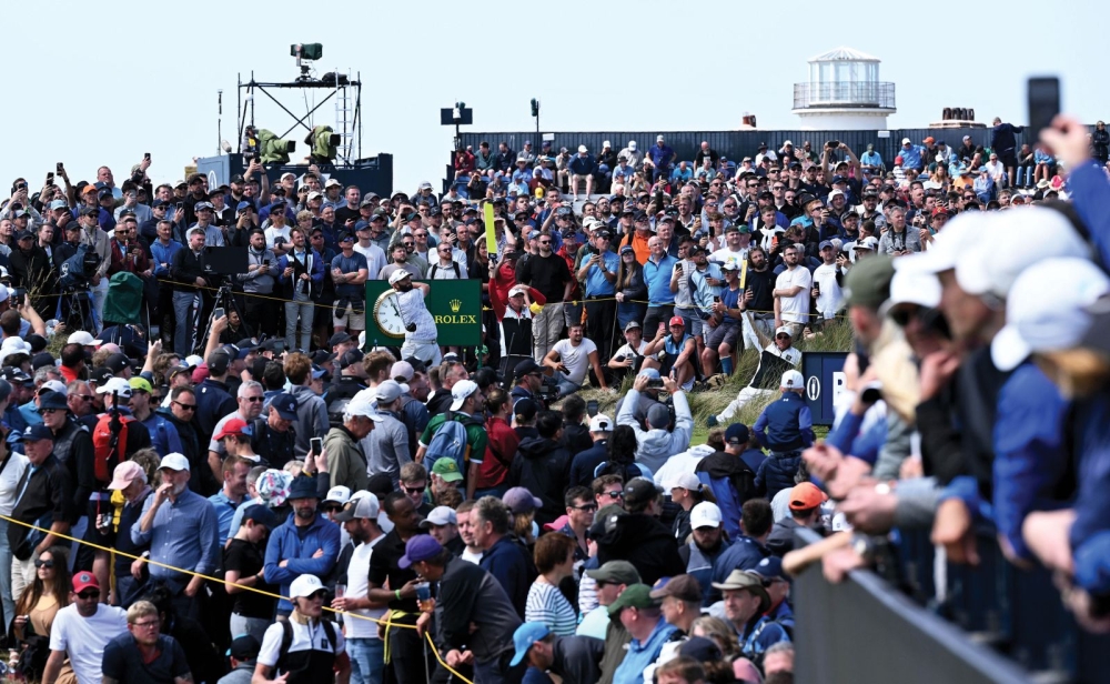 A very busy photograph of Jon Rahm driving from the 15th tee during round two. This par 5 was the longest hole ever in Open history at 620 yards, but many players reached the green in two comfortably.