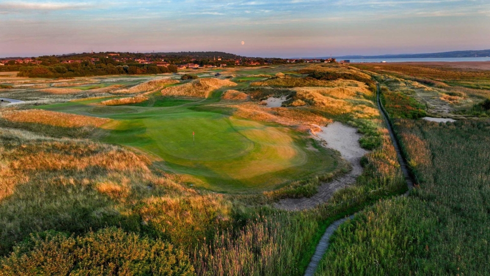On this pretty par 3, don't be distracted by the view of Hilbre Island and beyond. Focus on making sure you take enough club to carry the mounds which guard the front left hand side of the green.