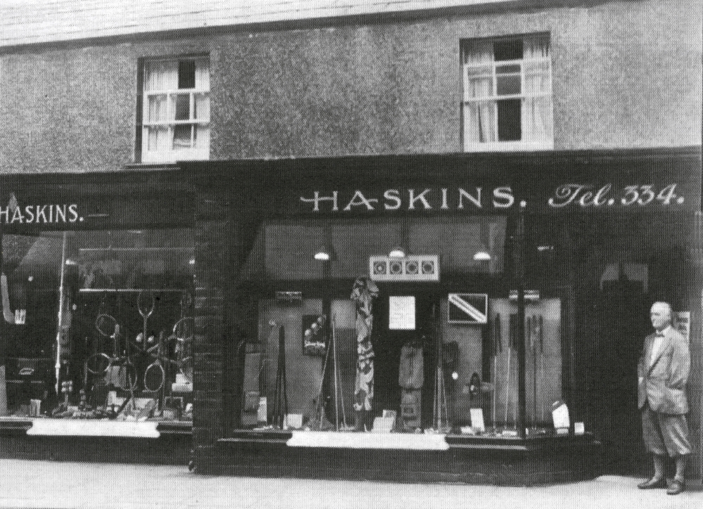 John Haskins, Fred Haskins' eldest brother, standing outside the family shop in Market Street, Hoylake. Despite losing his arm at the age of nine John still became a very successful professional.